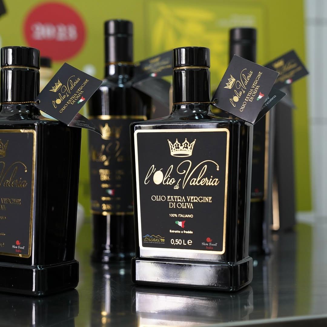 Fresh olive branches with Olio di Valeria bottle from San Biagio Platani